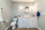 Basement suite bathroom with dual vanity 